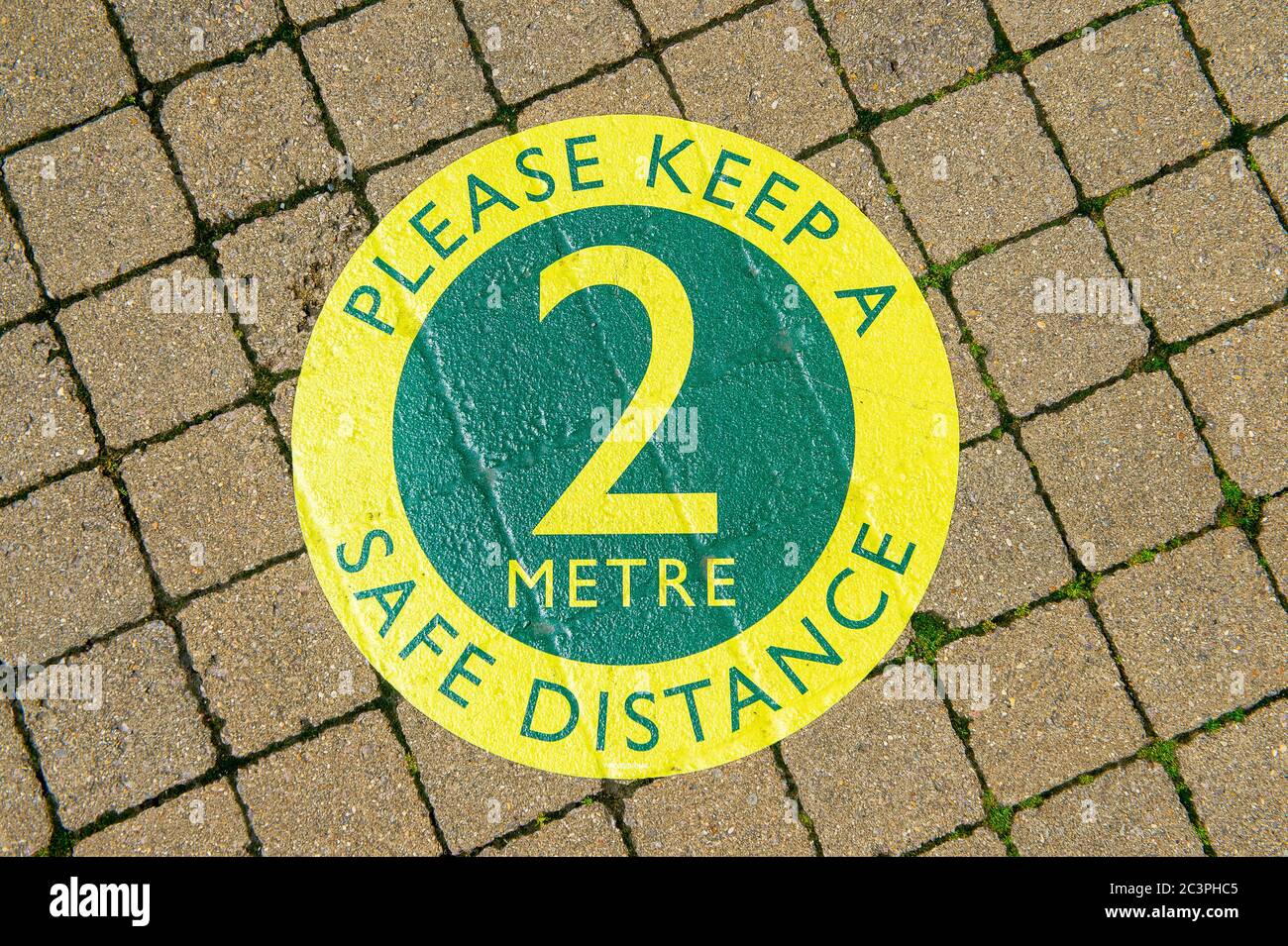Windsor, Berkshire, UK. 21st June, 2020. Many  retailers have spent a lot of money on social distancing signs for a distance of 2 metres, however, as pressure grows on the Government for the 2 metre rule to be scrapped or reduced to 1 metre, this may mean further expenditure by retailers on new point of sale signs. Credit: Maureen McLean/Alamy Stock Photo