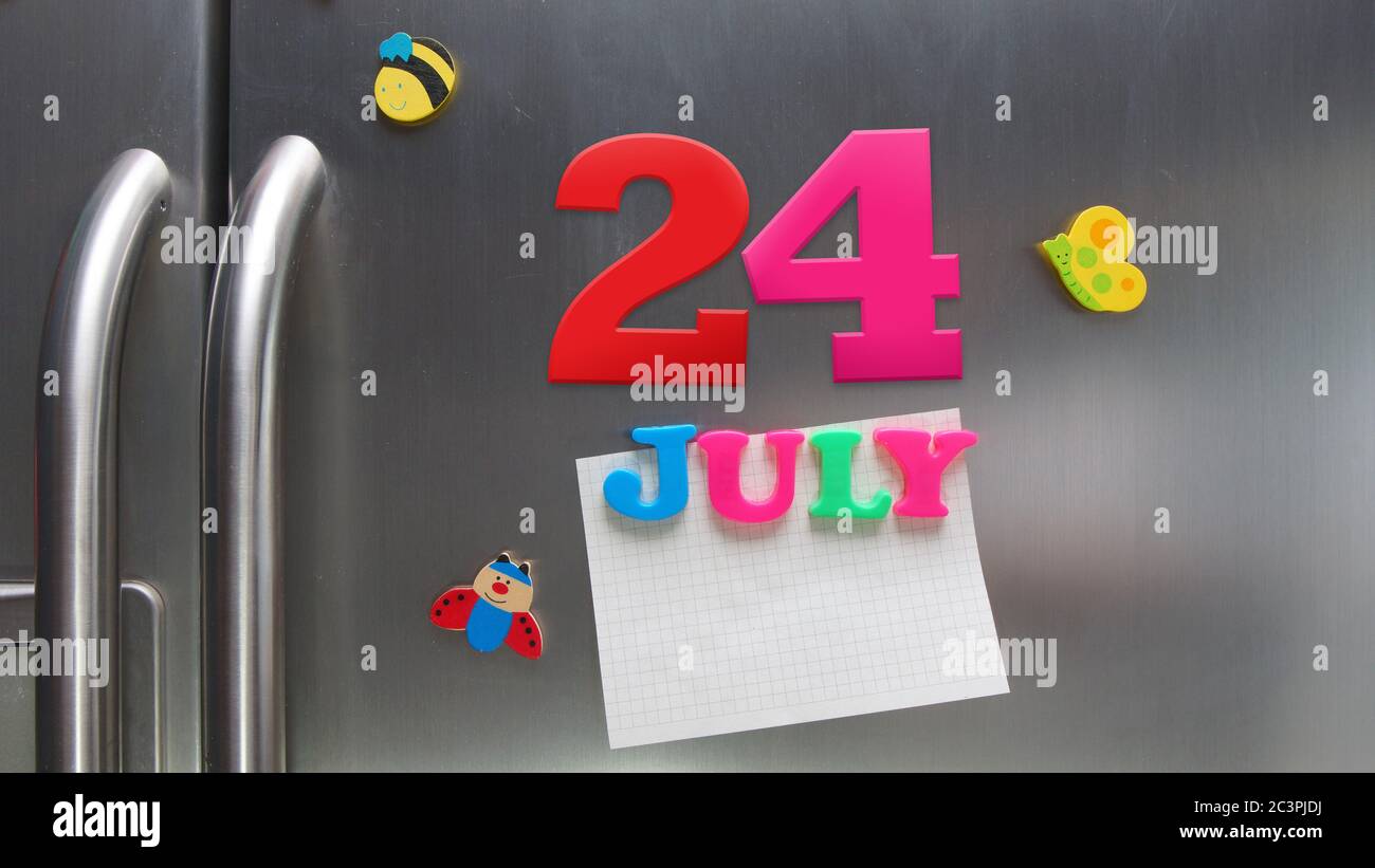 July 24 calendar date made with plastic magnetic letters holding a note of graph paper on door refrigerator Stock Photo