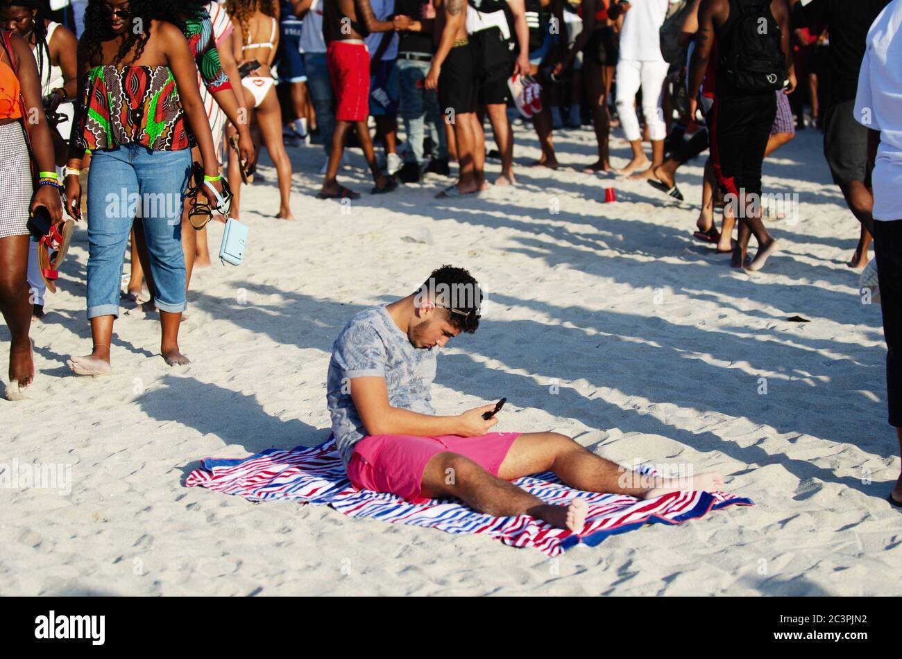 Group Of Young People At A Spring Break Beach Party Stock Photo, Royalty-Free