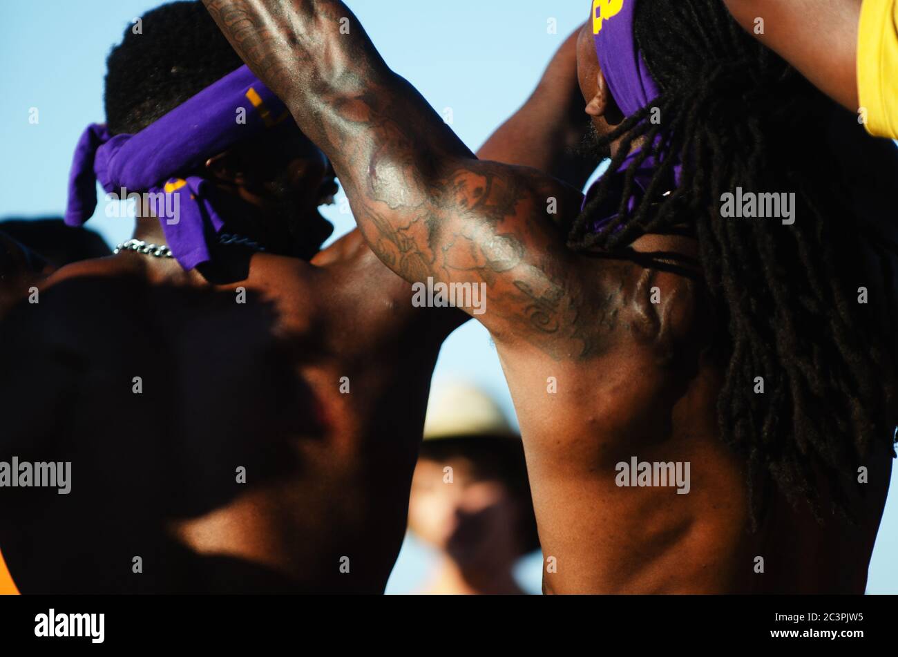 MIAMI - MARCH 23, 2019: Young men from the Omega Psi Phi fraternity perform in a step show at a Spring Break party on South Beach. Stock Photo