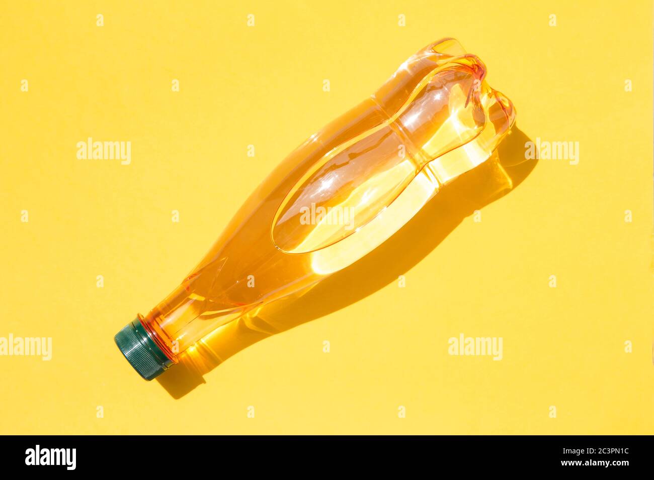Mineral water bottle on yellow background Stock Photo