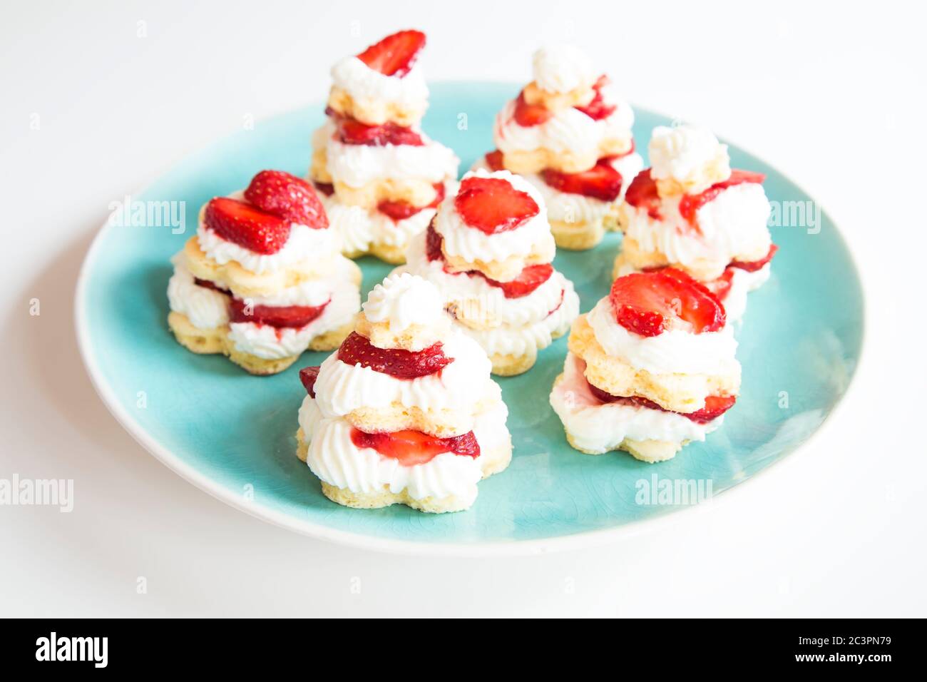 Strawberry cakes on blue plate Stock Photo