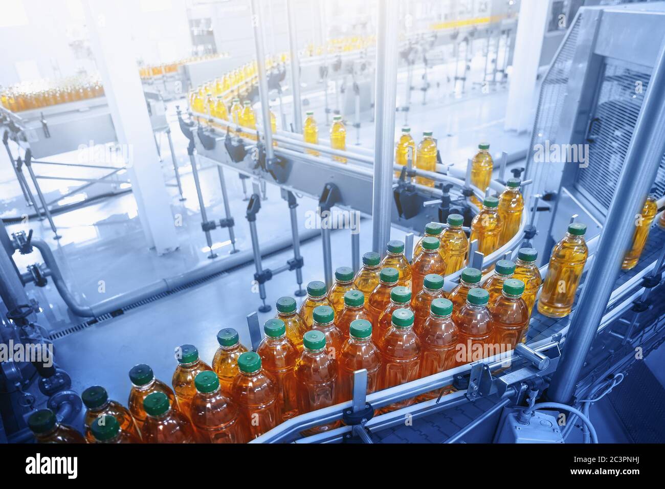 Beverage factory, Conveyor belt with juice in bottles, Industrial