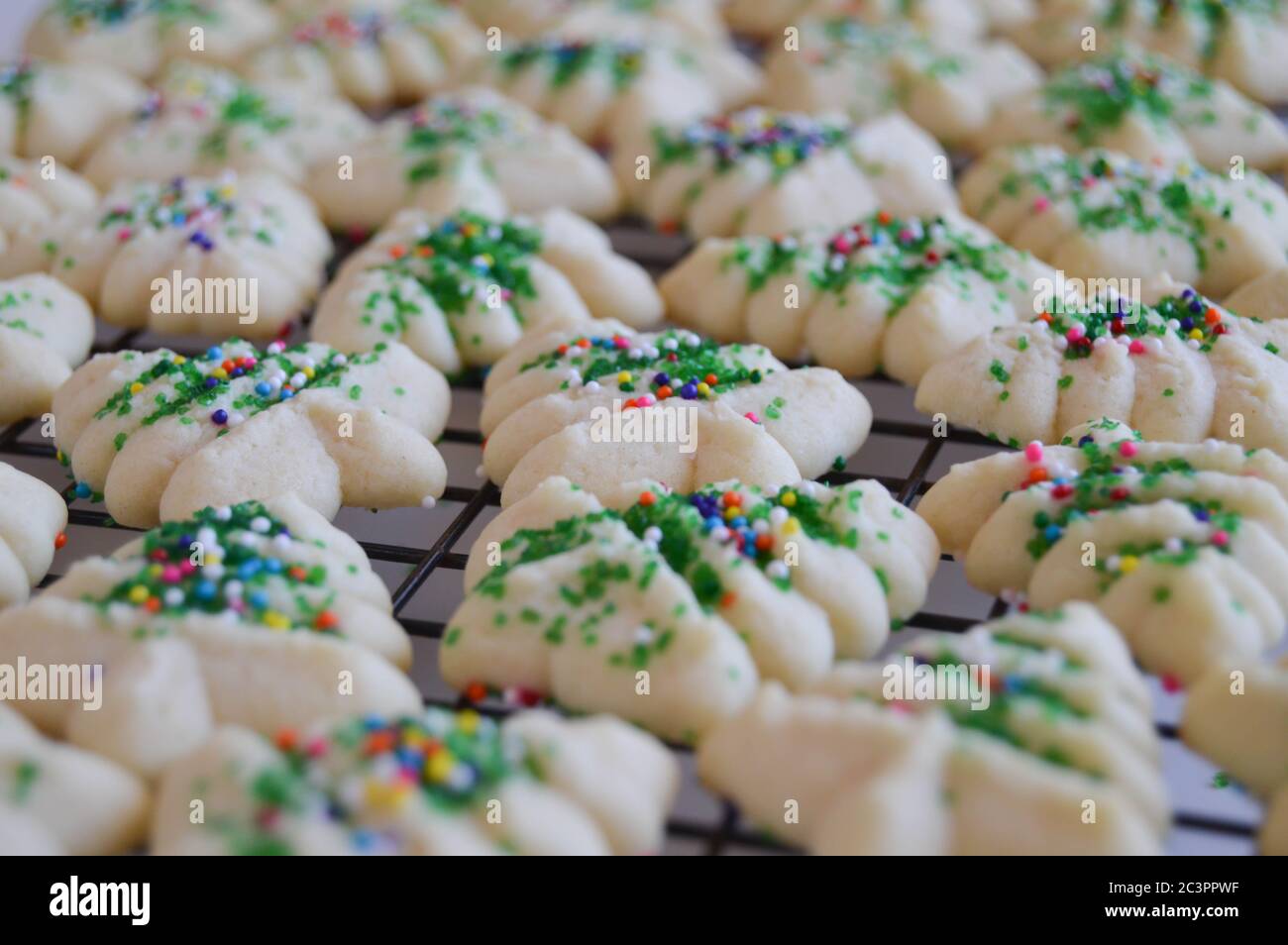 holiday spritz cookies on a wire cooling rack Stock Photo