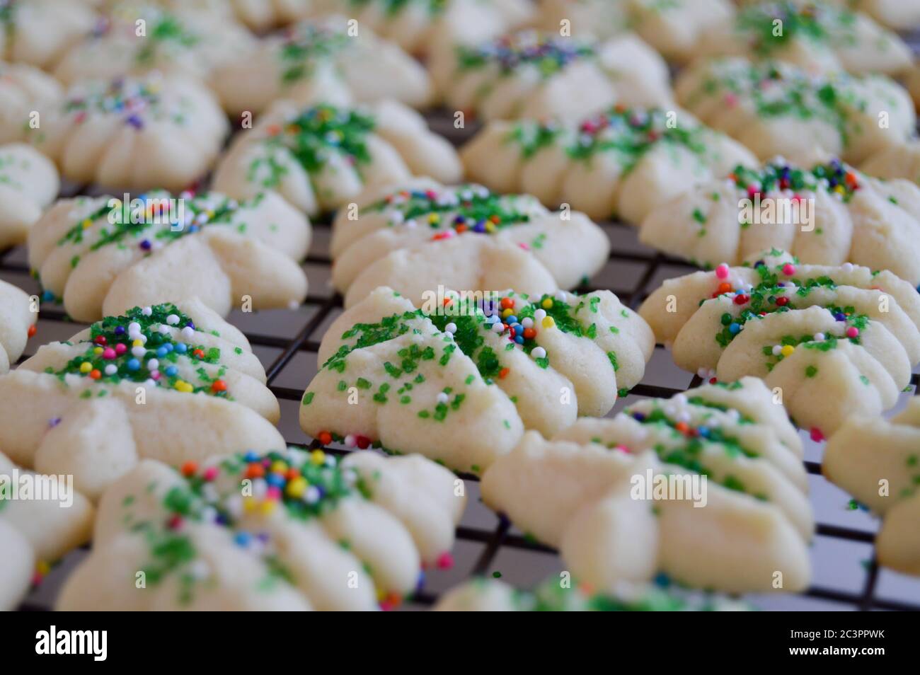 holiday spritz cookies on a wire cooling rack Stock Photo