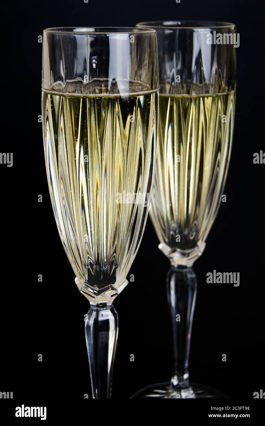 two glasses of champagne against a dark background Stock Photo