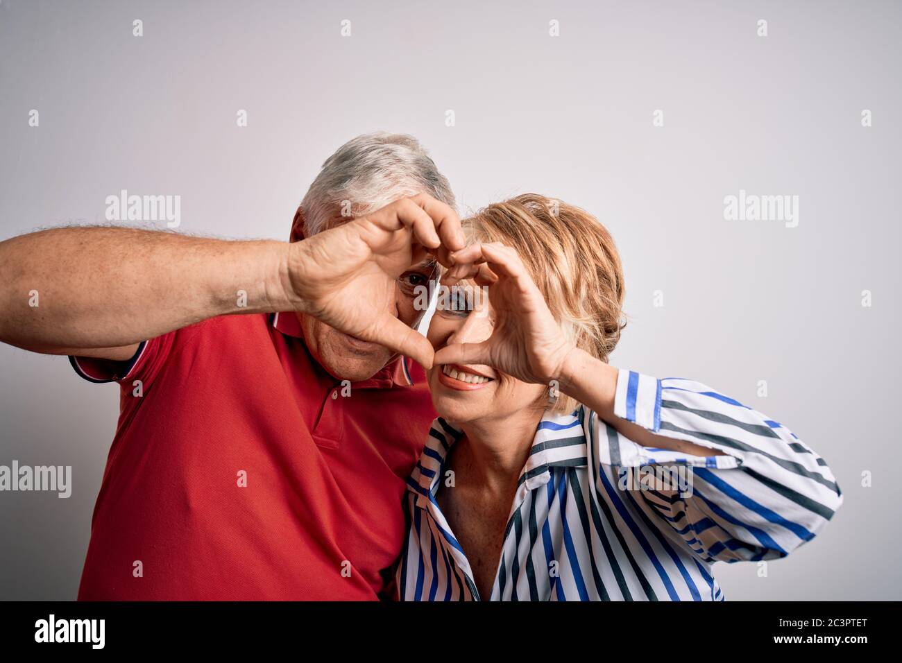 Senior beautiful couple standing together over isolated white ...