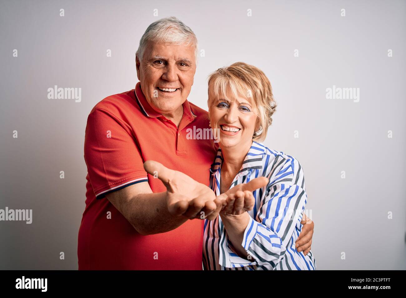 Senior beautiful couple standing together over isolated white ...