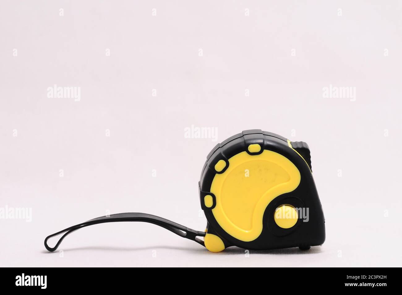 yellow tape measure isolated on white background Stock Photo - Alamy