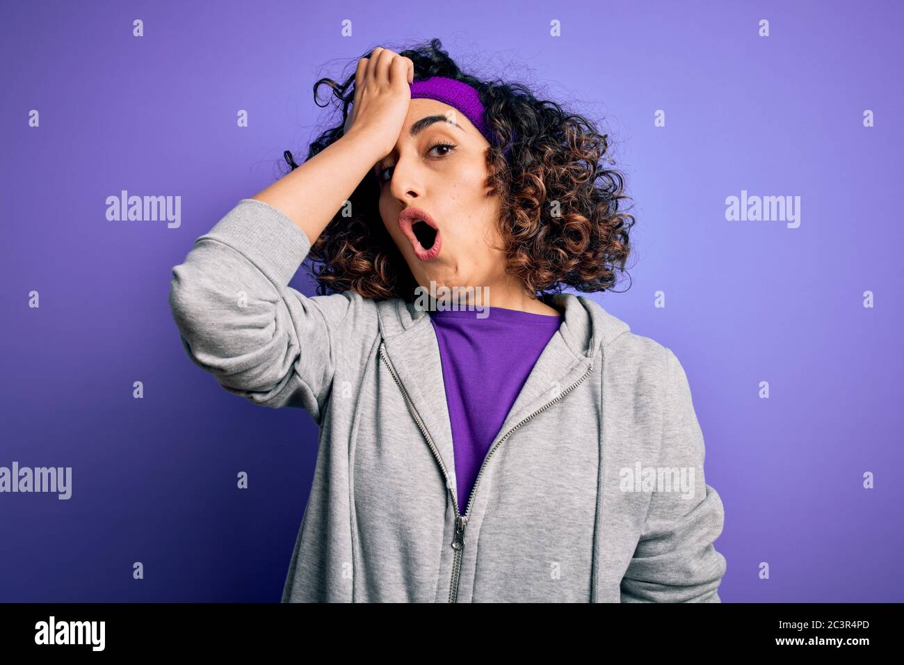 Beautiful curly arab sportswoman doing sport wearing sportswear over