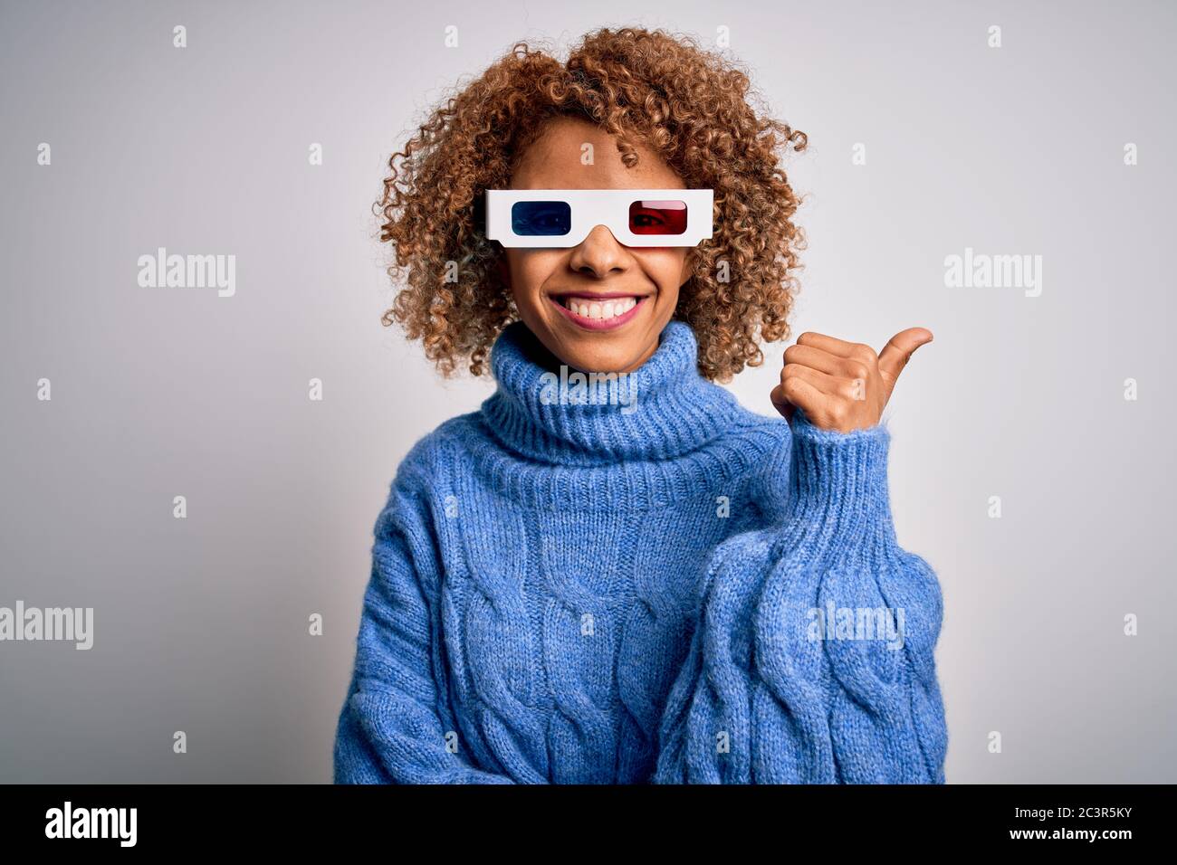Young african american curly woman wearing 3d glasses over isolated ...