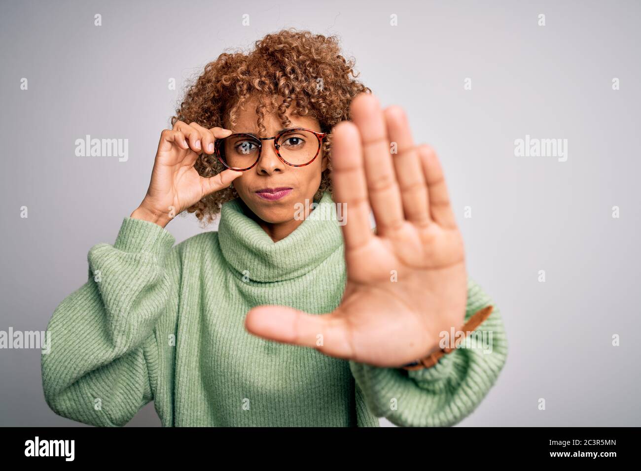 African american optical woman with curly hair wearing glasses over ...