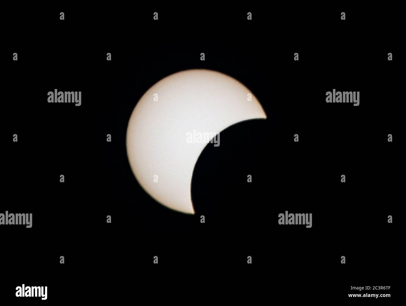 Damascus, Syria. 21st June, 2020. A solar eclipse is seen in the sky over Damascus, Syria, on June 21, 2020. An annular solar eclipse occurred on Sunday. Credit: Ammar Safarjalani/Xinhua/Alamy Live News Stock Photo