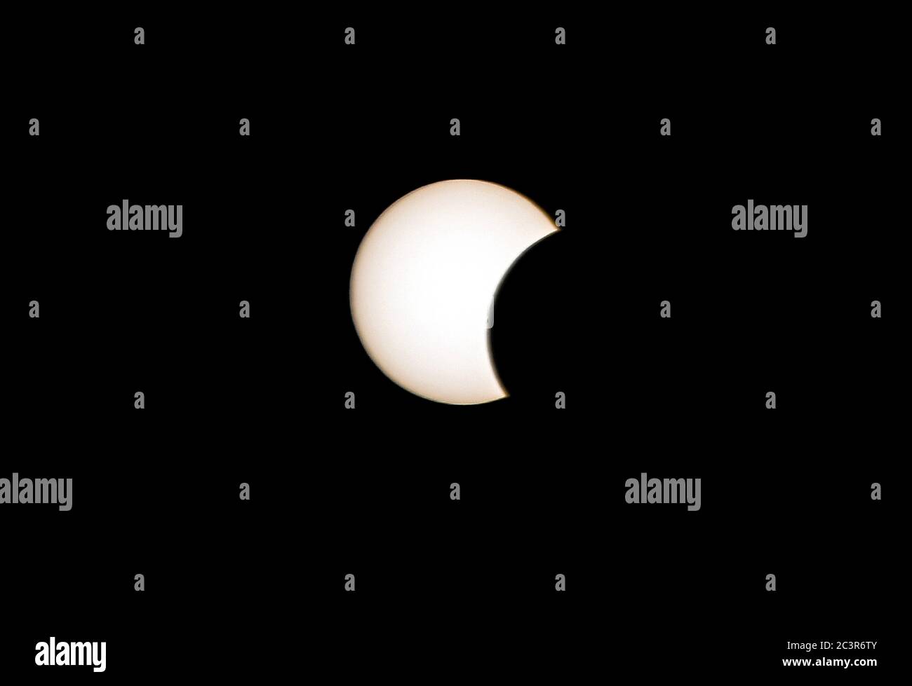 Damascus, Syria. 21st June, 2020. A solar eclipse is seen in the sky over Damascus, Syria, on June 21, 2020. An annular solar eclipse occurred on Sunday. Credit: Ammar Safarjalani/Xinhua/Alamy Live News Stock Photo