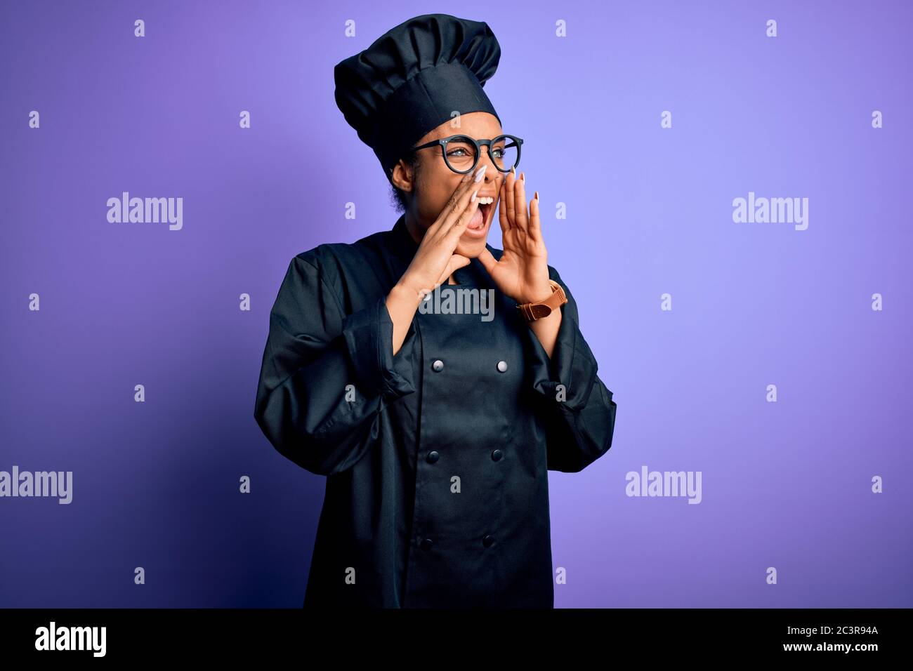 Young african american chef girl wearing cooker uniform and hat over ...