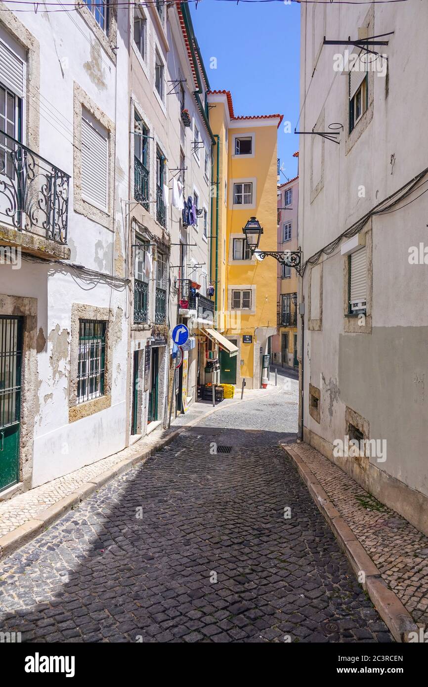 Narrow streets in historic district of Lisbon Stock Photo - Alamy