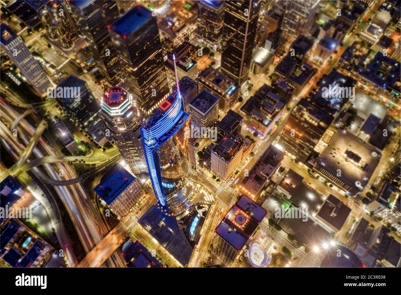 Aerial shot of Los Angeles covered in the lights at night in the US