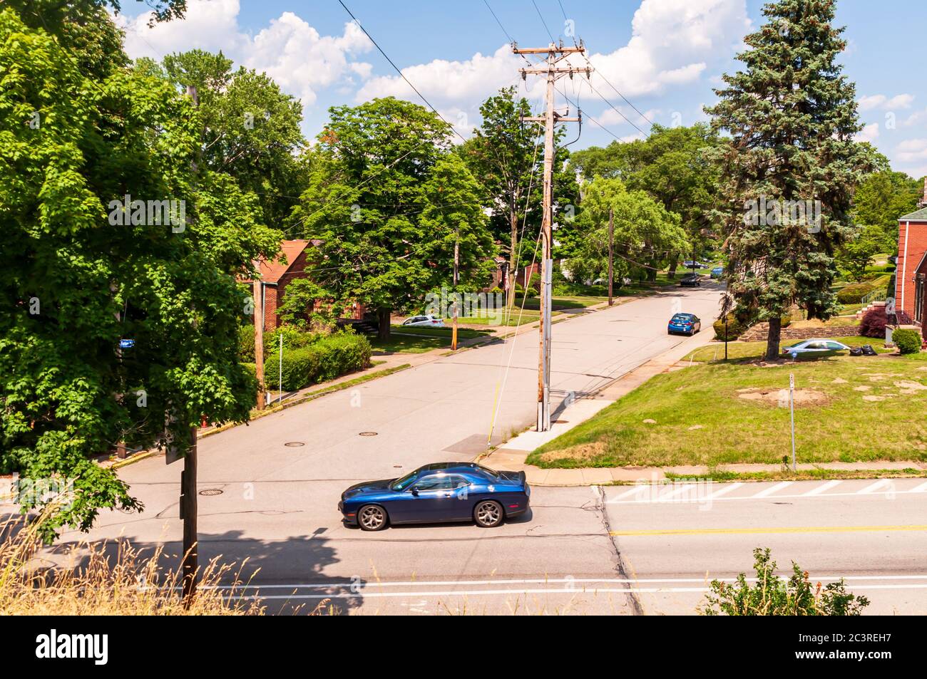 A car on Forbes Avenue passing the intersection of Aylesboro Avenue in