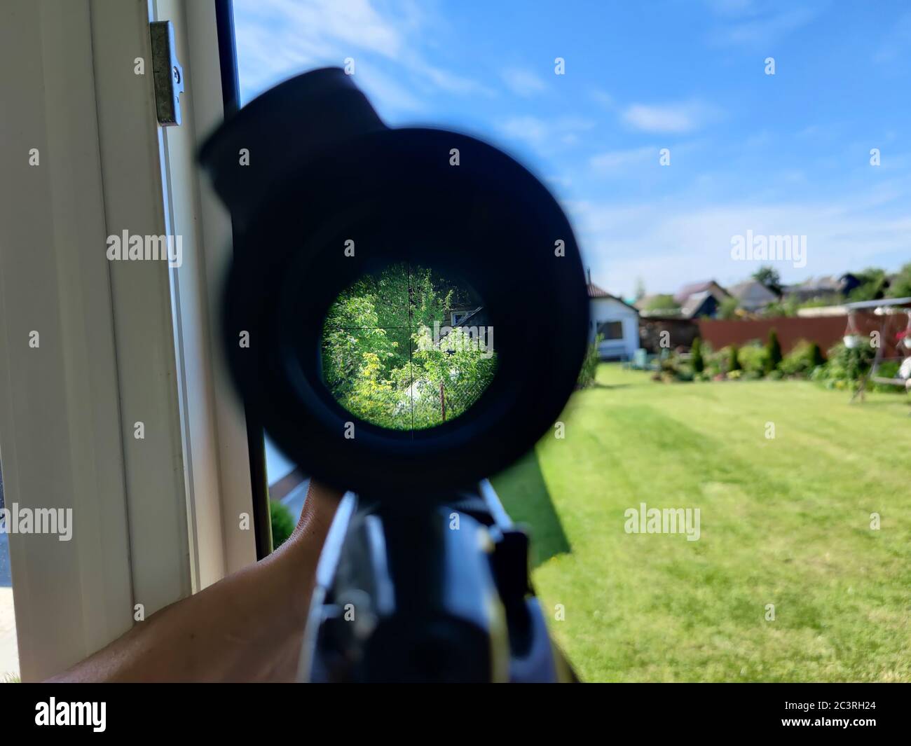 A look through an optical sight aimed at a group of potential targets at the range, outdoor shot. Stock Photo