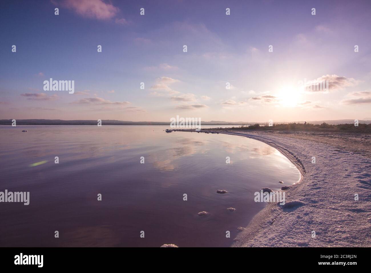 Beautiful scenery of a salty beach during a sunrise Stock Photo - Alamy