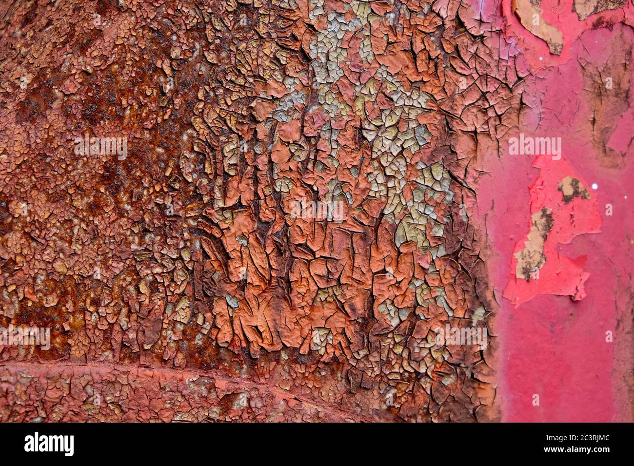 Severe rust with cracking and peeling and fading paint. Stock Photo