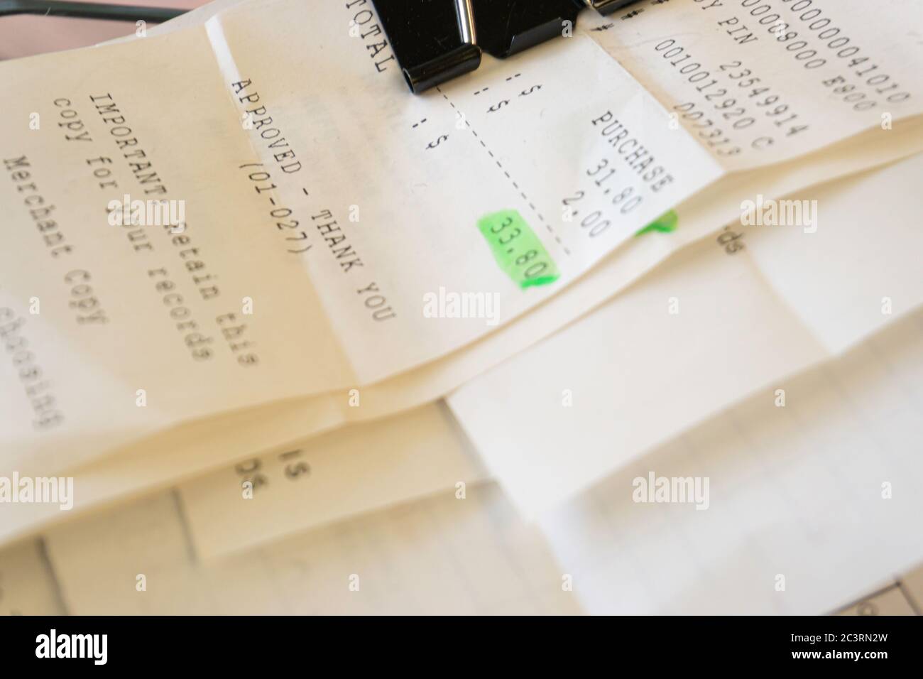 Credit card slips and invoices to claim business expenses on an expense