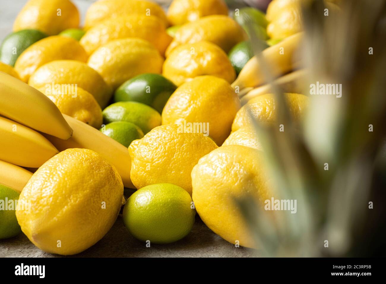 selective focus of colorful yellow and green delicious summer fruits ...