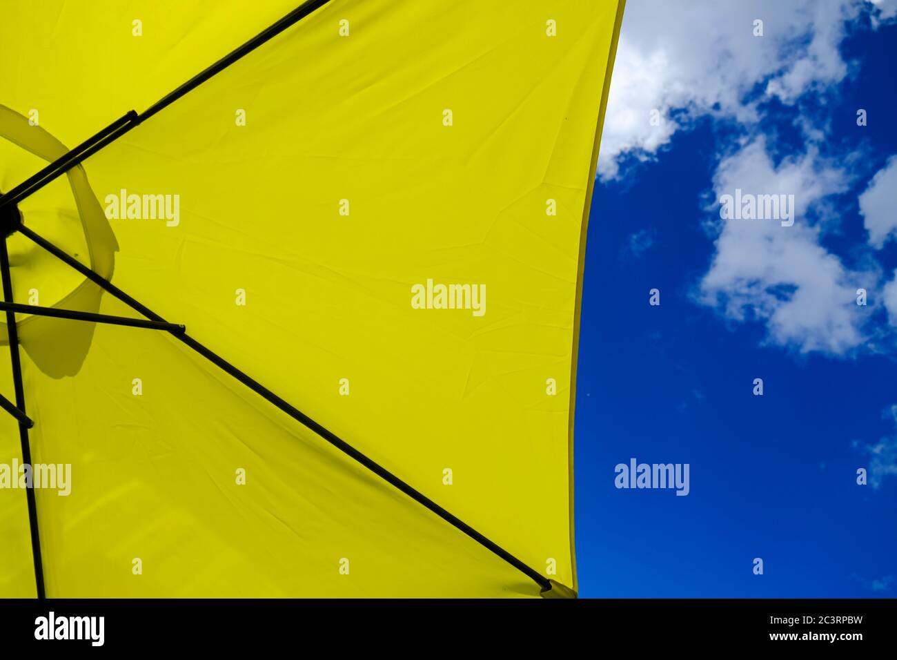 Yellow Deck Patio Umbrella Outside Under Sunny Skies Stock Photo Alamy
