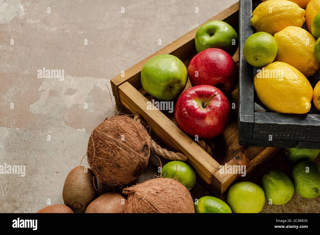 ripe fresh fruits in wooden boxes on weathered surface Stock Photo - Alamy