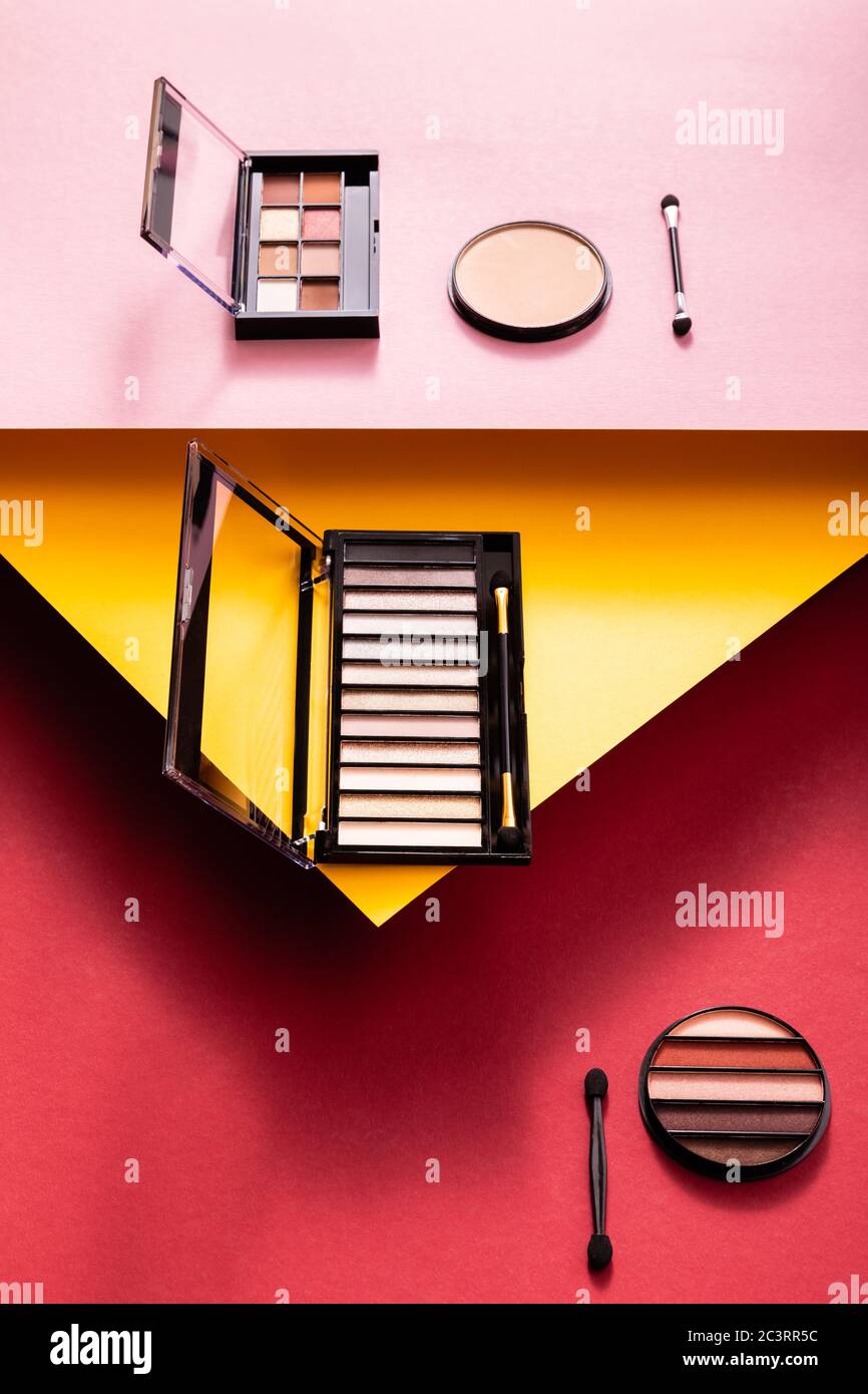 eye shadow palettes and doublesided eyeshadow applicators near face