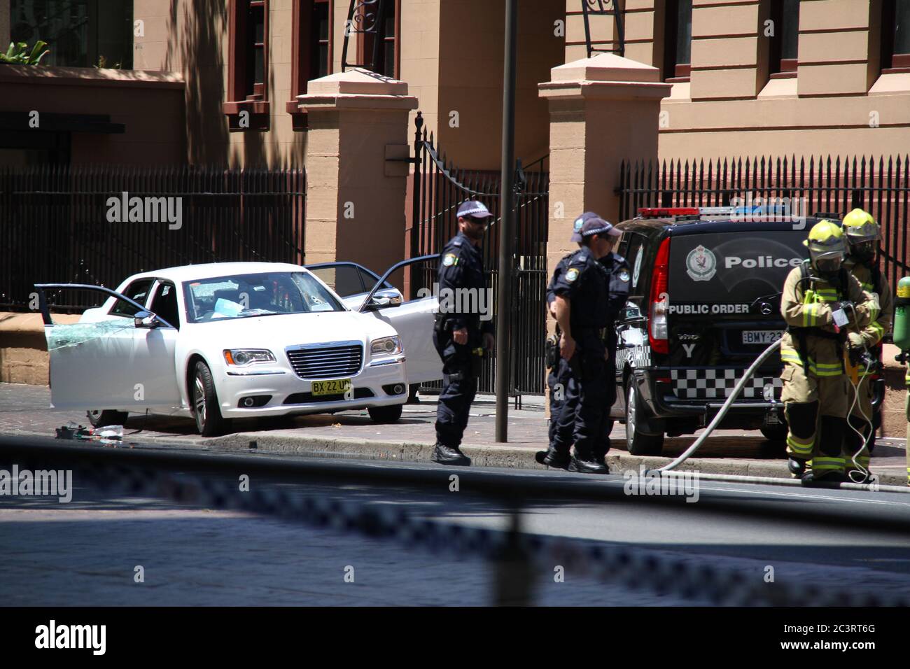 The windows of the white car are smashed after tactical operations and ...
