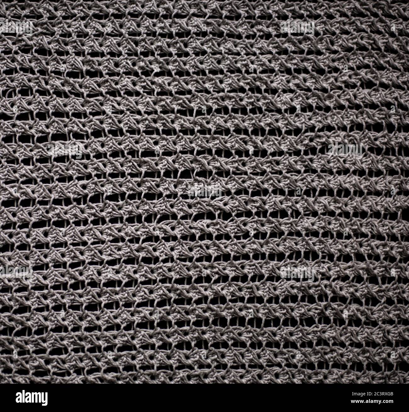Unusual Abstract grey knitted pattern background texture Stock Photo