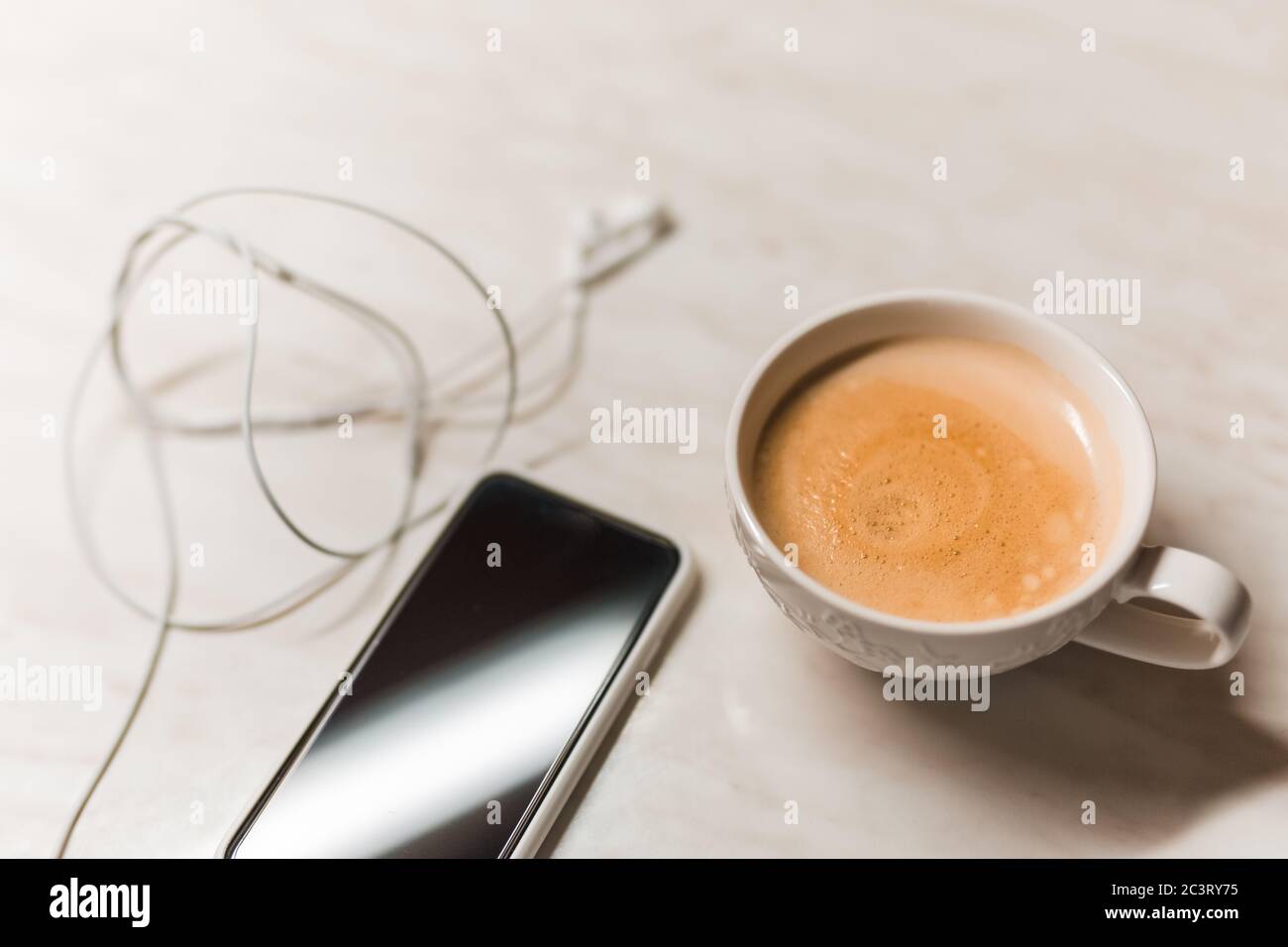 Phone and coffee on wood blank space Stock Photo