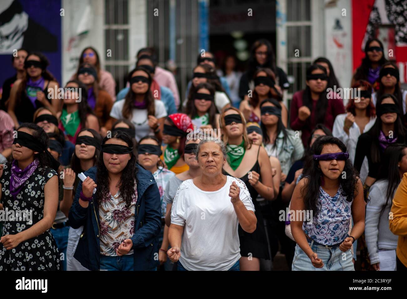 Feminist demonstrators, part of the me too revolution protest in the National University of Colombia to protest against women violence and president I Stock Photo