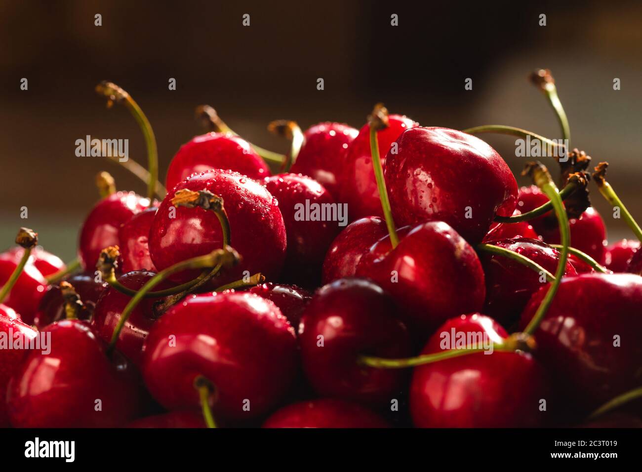 Angle view on ripe sweet cherries in backlight. Stock Photo