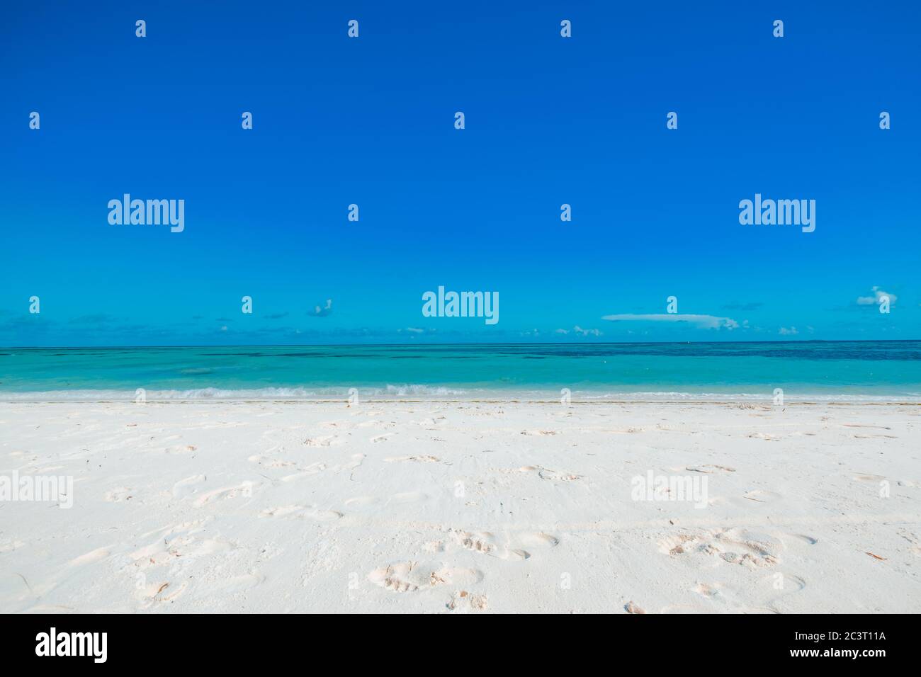 White sand beach with turquoise water and blue sky. Beach landscape, tropical nature pattern with copy space. Peaceful, relax, tranquility view Stock Photo