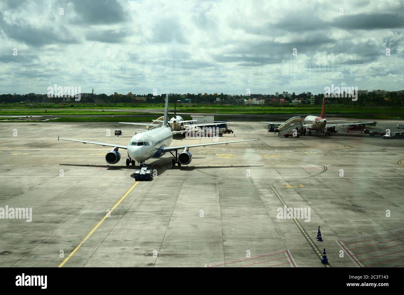 Passenger aircraft taxiing to terminal, in airport Stock Photo - Alamy