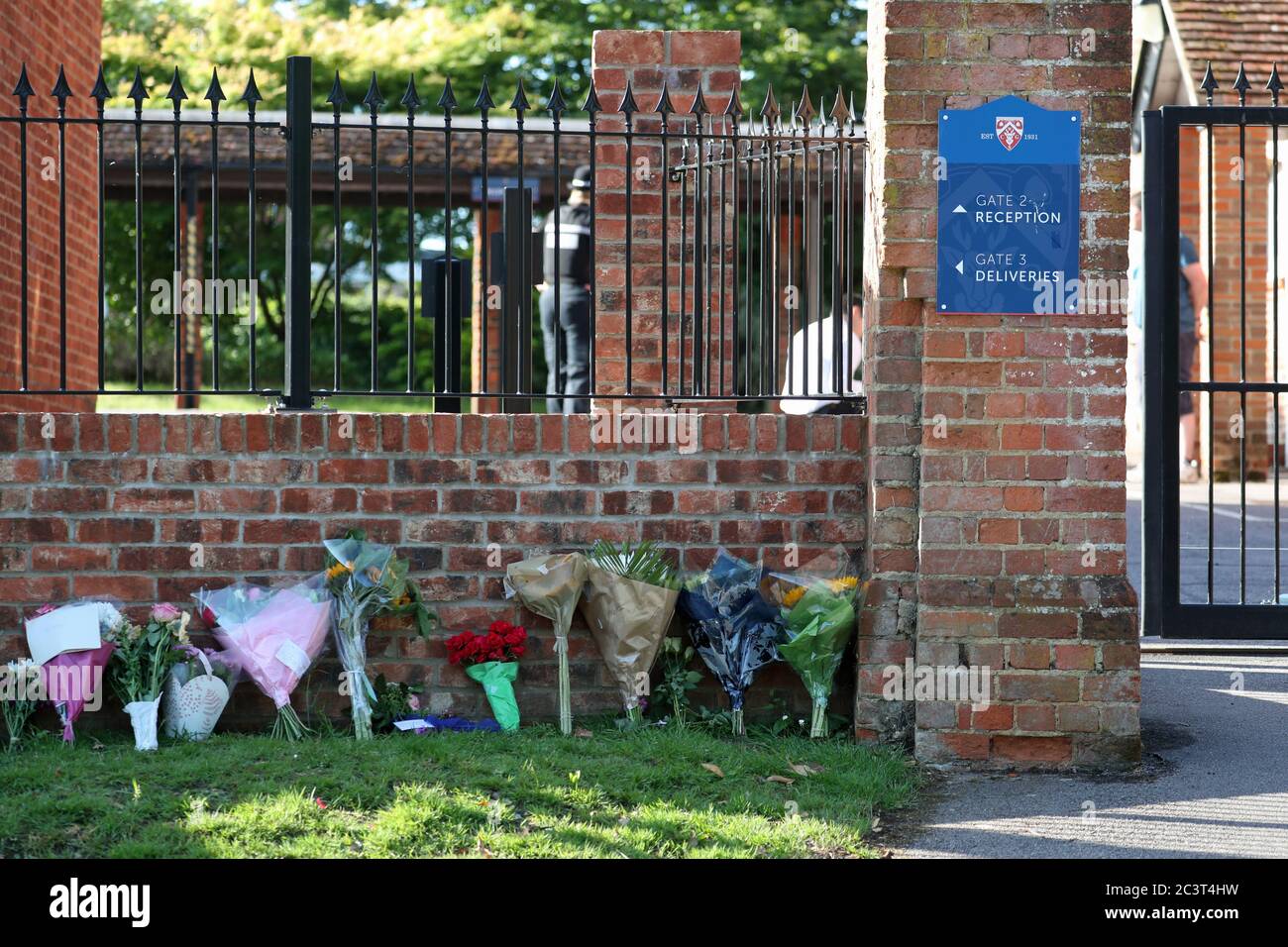 Flowers placed at the entrance to the Holt School, Wokingham, Berskhire, in memory of teacher James Furlong, a victim of the terrorist attack in Forbury Gardens, Reading, on Saturday in which three people died. Stock Photo