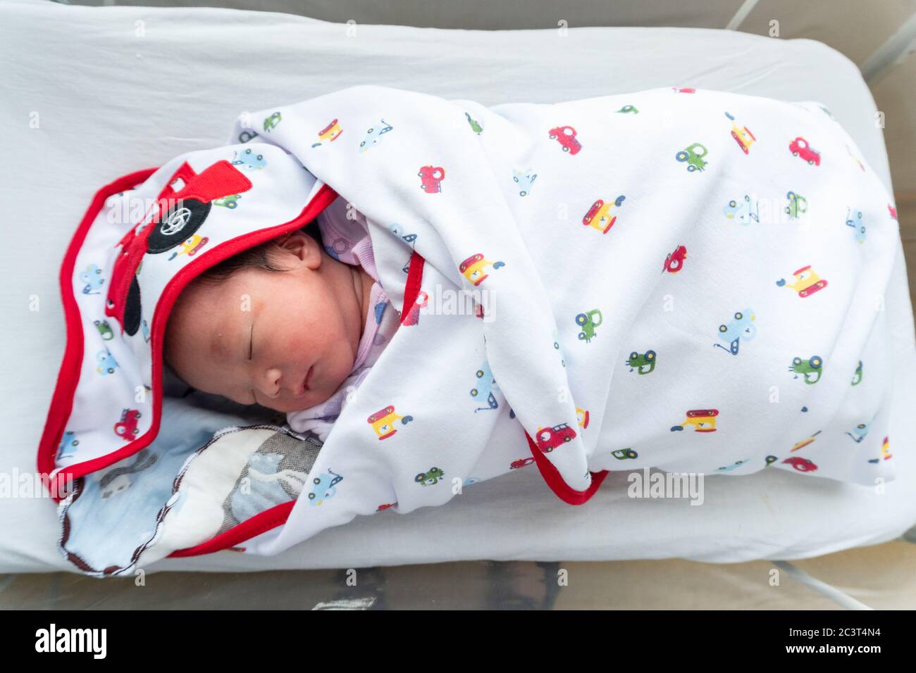 Asia Chinese Newborn baby sleeping. Cute adorable infant asleep