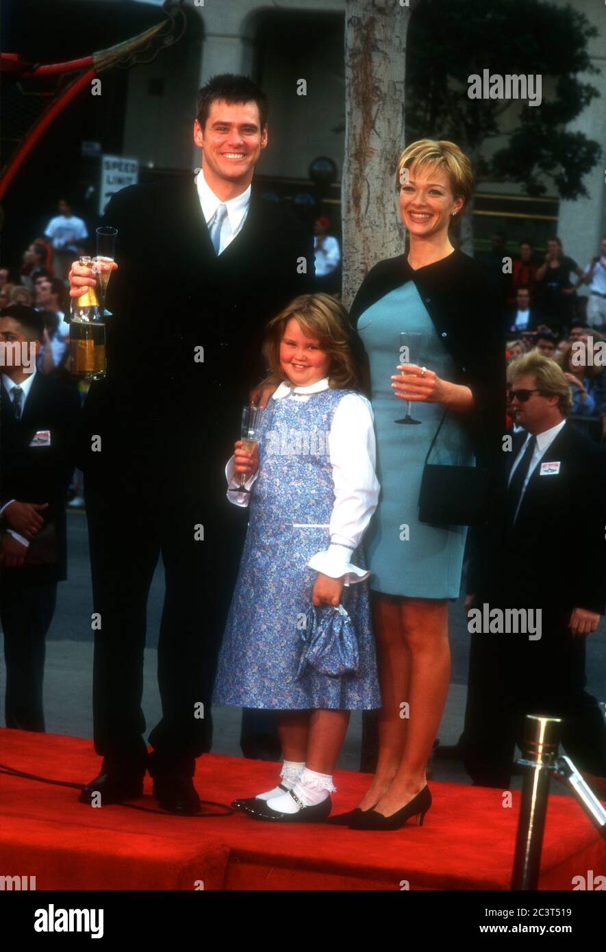 Hollywood, California, USA 2nd November 1995 Actor Jim Carrey, daughter Jane Carrey and actress Lauren Holly attend Jim Carrey's hand and footprint in cement ceremony on November 2, 1995 at Mann's Chinese Theatre in Hollywood, California, USA. Photo by Barry King/Alamy Stock Photo Stock Photo