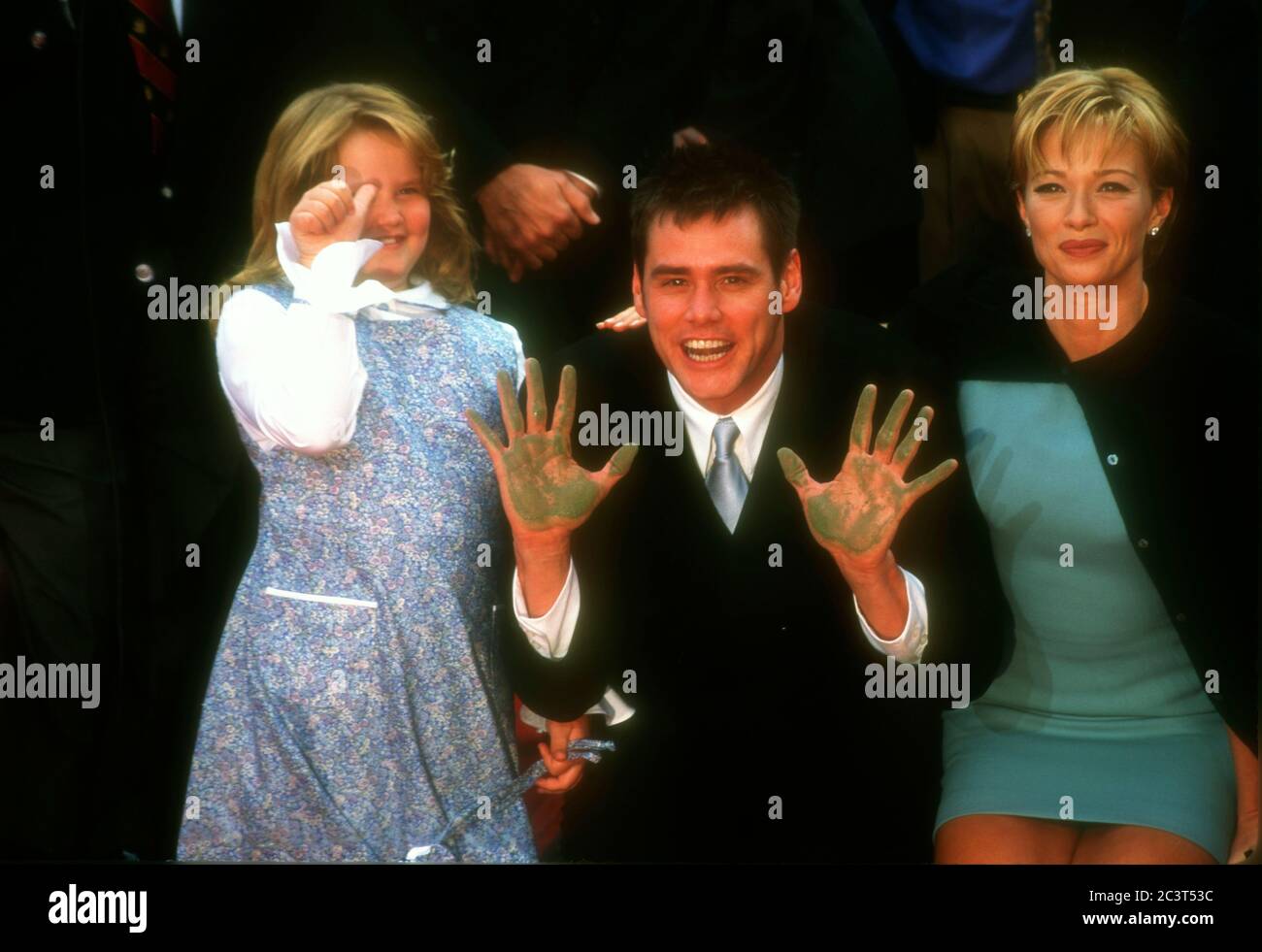 Hollywood, California, USA 2nd November 1995 Actor Jim Carrey, daughter Jane Carrey and actress Lauren Holly attend Jim Carrey's hand and footprint in cement ceremony on November 2, 1995 at Mann's Chinese Theatre in Hollywood, California, USA. Photo by Barry King/Alamy Stock Photo Stock Photo
