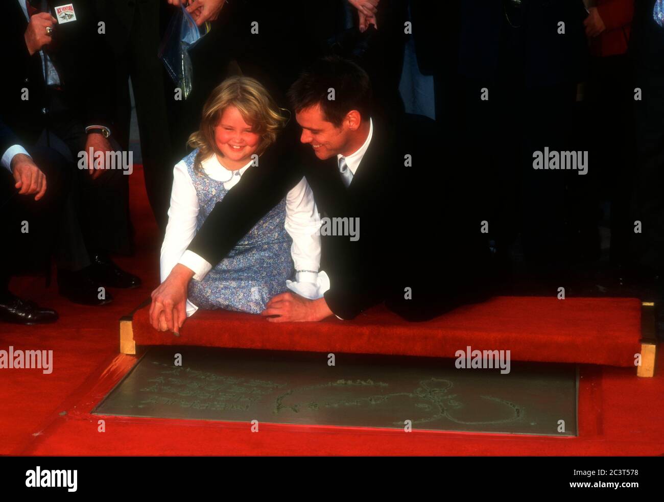 Hollywood, California, USA 2nd November 1995 Actor Jim Carrey and daughter Jane Carrey attend Jim Carrey's hand and footprint in cement ceremony on November 2, 1995 at Mann's Chinese Theatre in Hollywood, California, USA. Photo by Barry King/Alamy Stock Photo Stock Photo