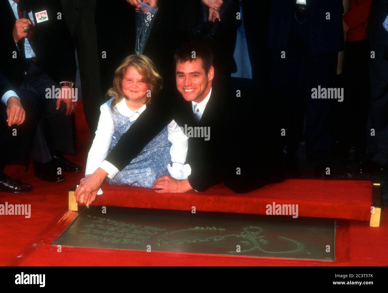 Hollywood, California, USA 2nd November 1995 Actor Jim Carrey, daughter Jane Carrey attend Jim Carrey's hand and footprint in cement ceremony on November 2, 1995 at Mann's Chinese Theatre in Hollywood, California, USA. Photo by Barry King/Alamy Stock Photo Stock Photo