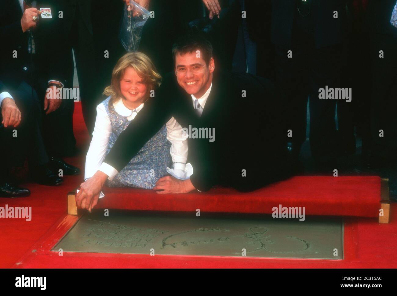 Hollywood, California, USA 2nd November 1995 Actor Jim Carrey and daughter Jane Carrey attend Jim Carrey's hand and footprint in cement ceremony on November 2, 1995 at Mann's Chinese Theatre in Hollywood, California, USA. Photo by Barry King/Alamy Stock Photo Stock Photo