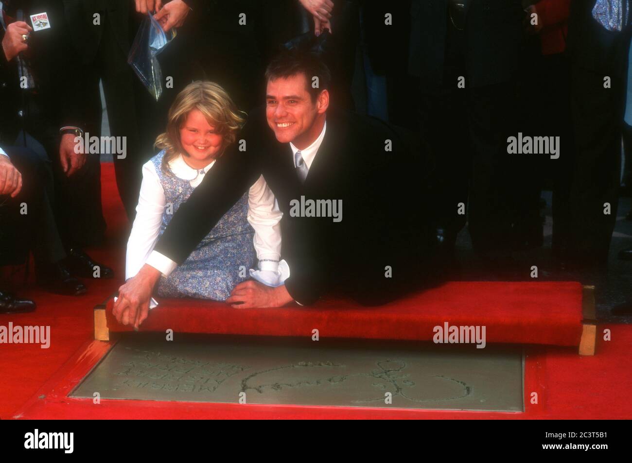 Hollywood, California, USA 2nd November 1995 Actor Jim Carrey and daughter Jane Carrey attend Jim Carrey's hand and footprint in cement ceremony on November 2, 1995 at Mann's Chinese Theatre in Hollywood, California, USA. Photo by Barry King/Alamy Stock Photo Stock Photo