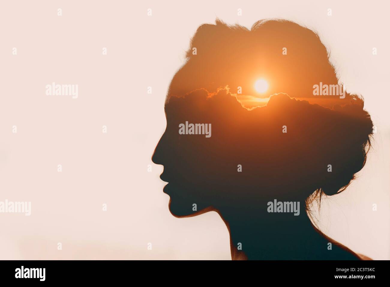 Woman with sun over clouds in her head. Mental health concept. Stock Photo