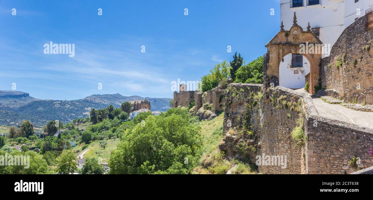 Panorama of the old city wall and surrounding mountains in Ronda, Spain Stock Photo