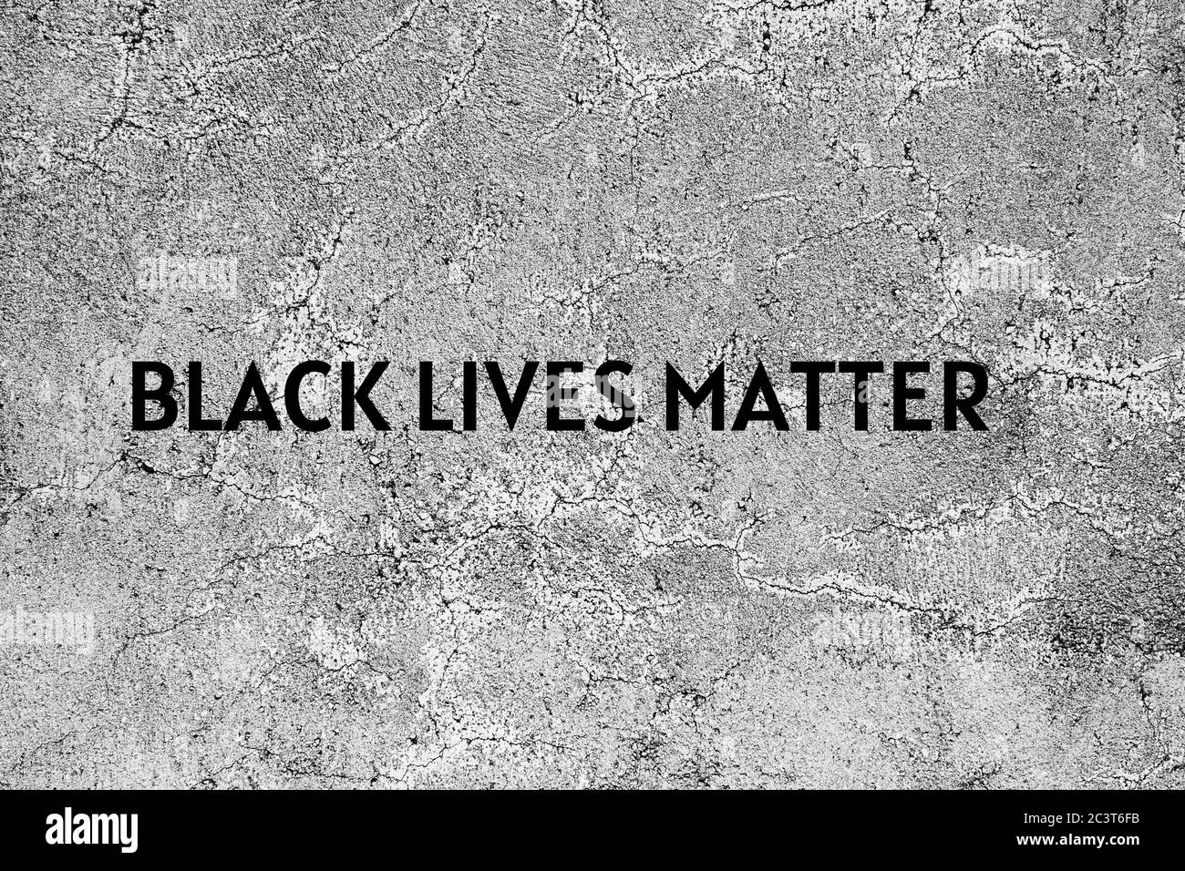 Black lives matter background on asphalt surface. Black and white. Stop racism layout.  Stock Photo