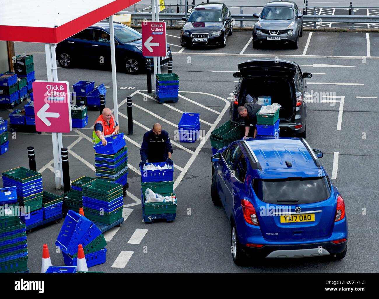 Customers at Click & Collect point, Tesco store in Batley, West Yorkshire, England UK Stock Photo