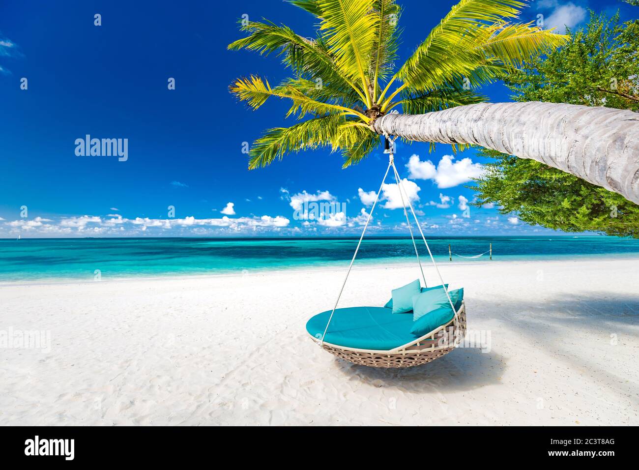 Tropical beach background as summer landscape with beach swing or hammock white sand calm sea for beach banner. Perfect beach scene vacation holiday Stock Photo